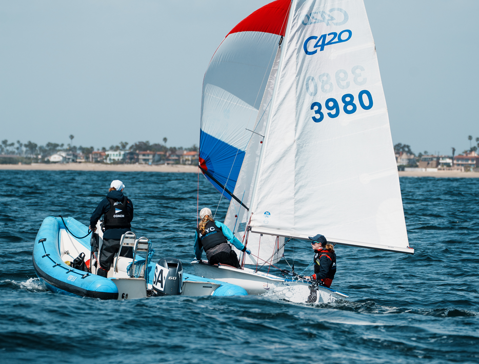 Sailing coach and C420 on the water